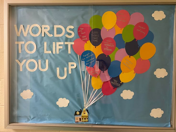 a bulletin board with balloons attached to it and the words words to lift you up