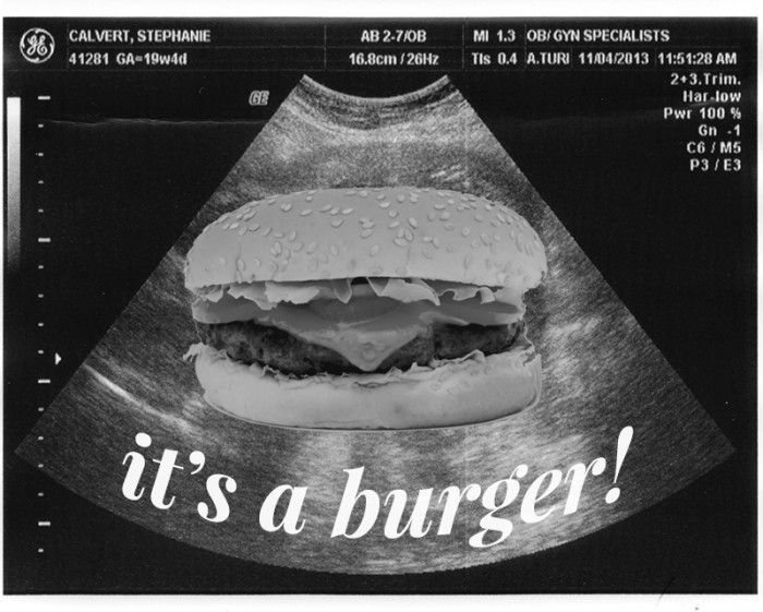 a black and white photo of a cheeseburger with the words it's a burger