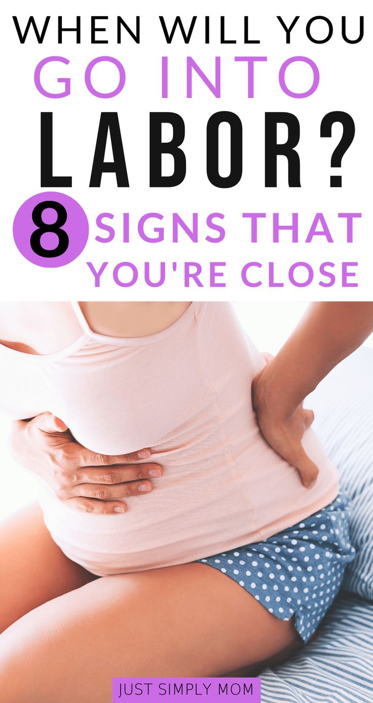 a pregnant woman sitting on her stomach with the text when will you go into labor? 8 signs that you're close