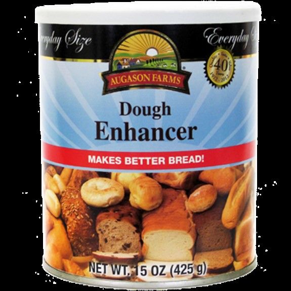 an open can of dough enhancer that is filled with breads and other baked goods