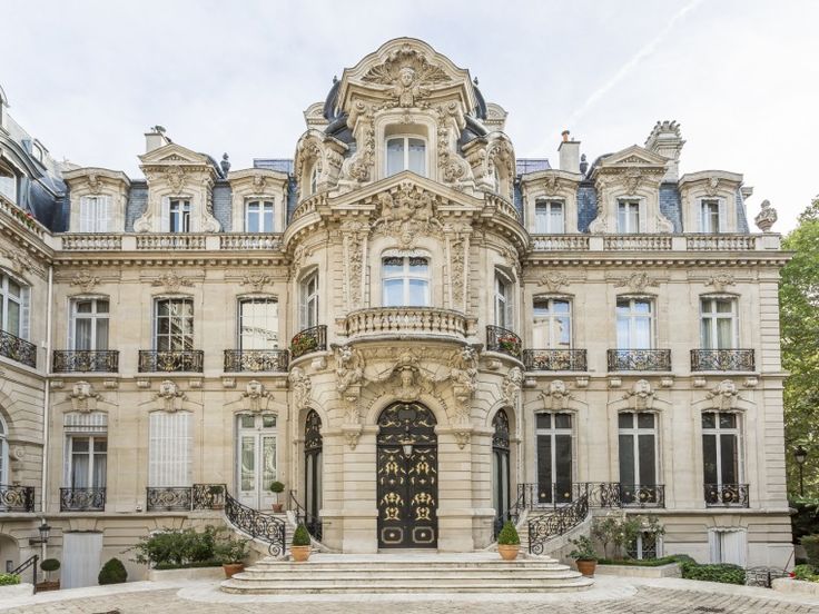 a large building with many windows and balconies