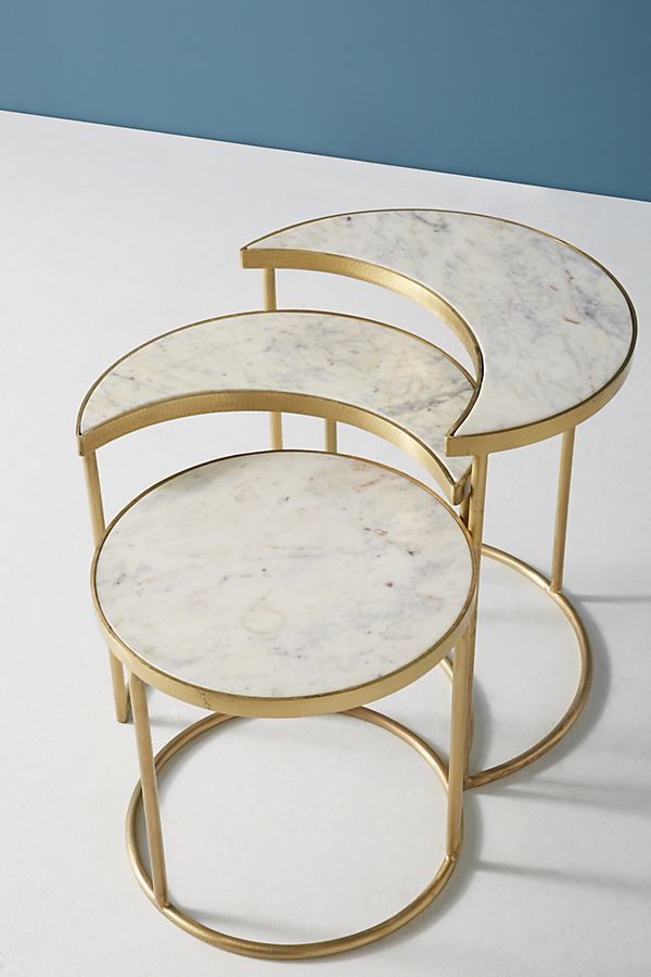 three round marble tables with gold metal bases