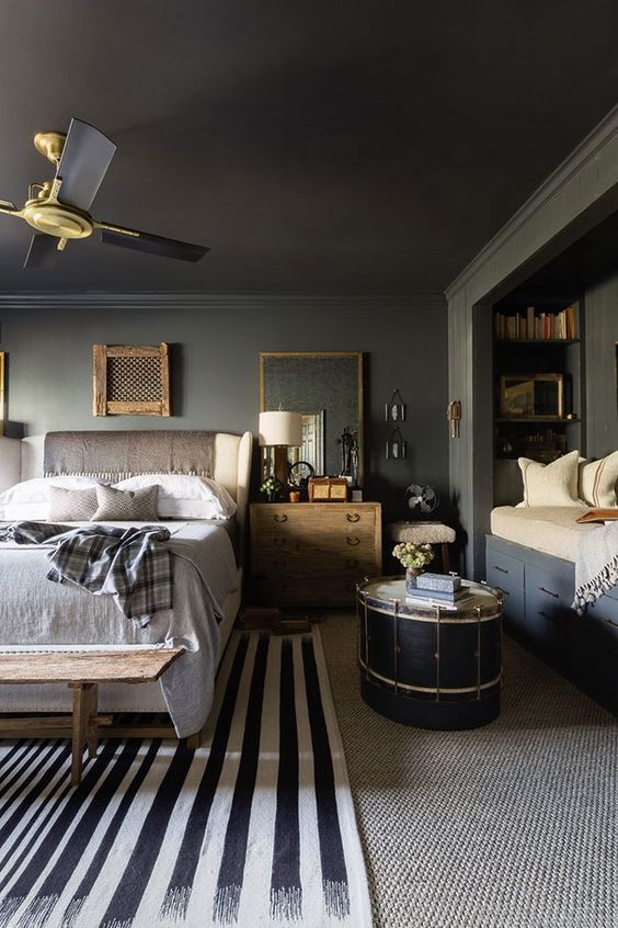 an instagram page showing a bedroom with black and white striped flooring, gray walls,