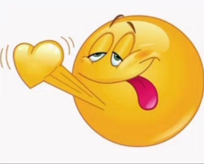 an emoticive smiley face holding a heart