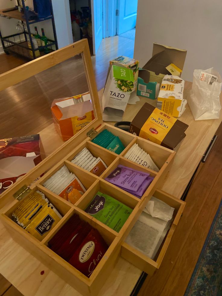 an open wooden box on top of a table