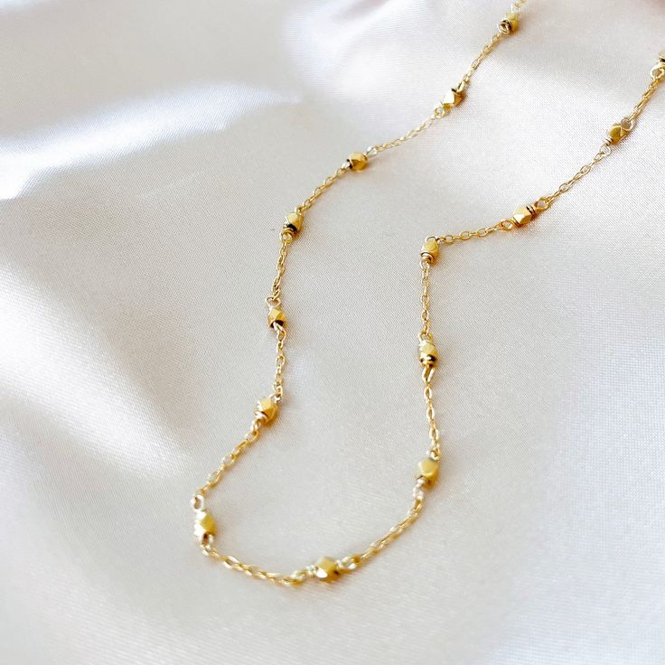 Our signature gold chain. Uniquely designed for layering over any necklace in our collection. Handmade, tarnish resistant 14k gold plated chain. Adjustable between 16"-18". Long Yellow Gold Everyday Chain Necklace, Dainty Station Necklace With Delicate Chain As Gift, Long Yellow Gold Chain Necklace For Everyday, Everyday Long Yellow Gold Chain Necklace, Gold Necklace With Adjustable Oval Link Chain, Dainty 14k Gold Chain Charm Necklace, Dainty Yellow Gold Necklace With Adjustable Chain, 14k Gold Chain Link Necklace Gift, Dainty Chain Link Necklaces For Everyday