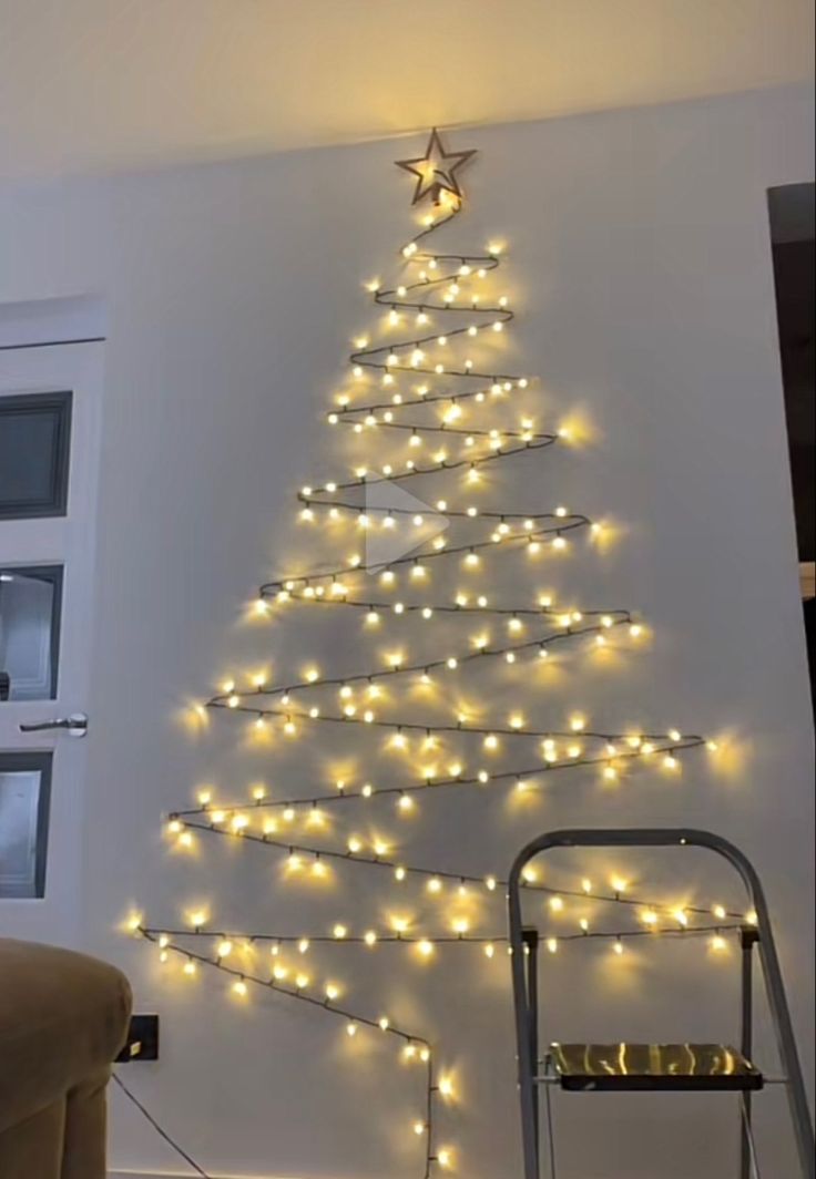 a christmas tree made out of lights on the wall