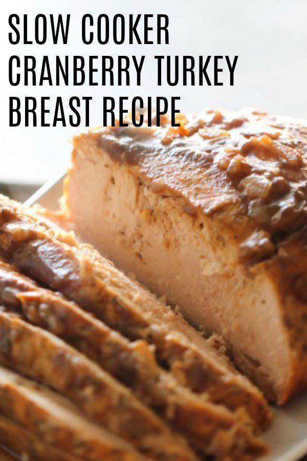 slow cooker cranberry turkey breast recipe on a white plate with text overlay