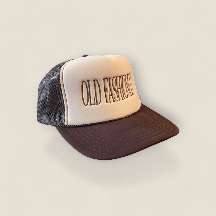 Stand out from the crowd with our Old Fashioned Trucker Hat in a classic khaki and brown color combination. Perfect for the playful and quirky drinker who always appreciates a good throwback cocktail. Cheers to making a statement with style! Vintage Black Trucker Hat For Spring, Vintage Hats For Outdoor Fall Use, Vintage Outdoor Hat For Fall, Vintage Fall Hat For Outdoor, Brown Trucker Hat Baseball Cap For Spring, Vintage Distressed Brown Hat With Curved Brim, Brown Trucker Hat With Flat Brim, Brown Trucker Hat For Streetwear, Brown Trucker Hat For Spring