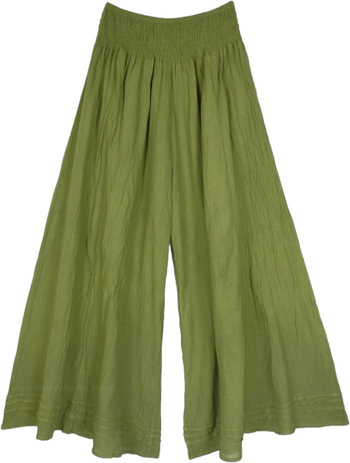 A cool pair of palazzo pants in olive green that you can wear in every season; these pants are extremely comfortable and are made of lightweight cotton fabric.  The bottom of the pants is very wide, which gives it a flowy and feminine look as you walk. #tlb #SplitSkirtsPants #Crinkle #vacationclothing #beachwrap #bohemianfashion #WideLegPants #GreenPants #HippiePants Khaki Wide Leg Cargo Pants, Green Solid Wide-leg Pants, Olive Wide-leg Spring Pants, Olive Wide-leg Pants For Spring, Olive Cotton Bottoms For Summer, Olive Wide Leg Summer Bottoms, Olive Wide Leg Bottoms For Summer, Olive Cotton Summer Bottoms, Summer Khaki Cotton Wide Leg Pants