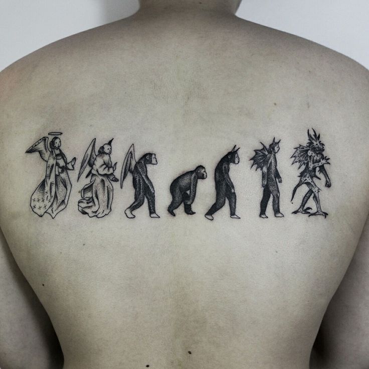 the back of a man's shoulder with an image of people and animals on it