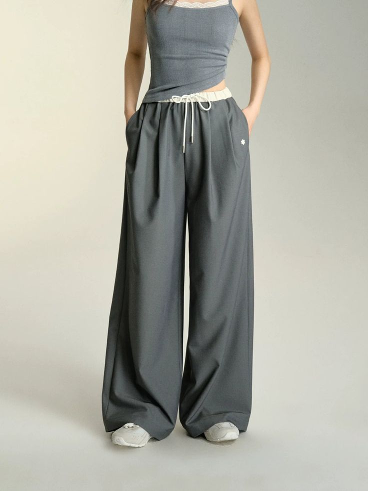 Unwind in style with our Relaxed Fit Drawstring Waist Wide Leg Pants. These pants offer the perfect combination of comfort and fashion, with a relaxed fit and adjustable drawstring waist. The wide leg design adds a trendy twist to any look. Get ready to lounge or hit the town in these versatile pants. Material: 60% Polyester 35% Cotton 5% Spandex Size Chart: Size Waist (cm) Hip (cm) Length (cm) S 64 100 104 M 68 104 105.5 Note: All measurements are in centimeters (cm). Chic Wide Leg Pants With Drawstring In Relaxed Fit, Chic Wide Leg Pants With Drawstring And Relaxed Fit, Relaxed Fit Wide Leg Pants With Drawstring, Baggy Drawstring Wide-leg Harem Pants, Baggy Wide-leg Drawstring Pants, Baggy Drawstring Wide-leg Pants, Leisure Wide Leg Harem Pants With Elastic Waistband, Baggy Wide-leg Pants With Drawstring, Chic Solid Color Wide Leg Pants With Drawstring