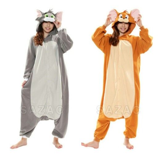 two people in animal onesuits are standing next to each other and one is wearing a cat costume