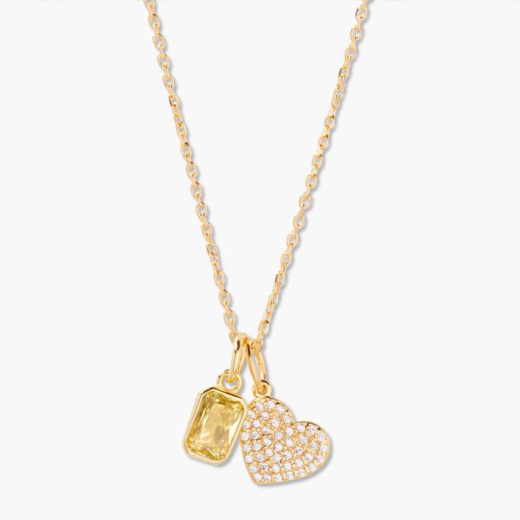 Add some charm to your look with the Adeline Heart Birthstone Necklace. This custom necklace features a beautiful heart charm, personalized with a birthstone of your choice. The gold chain adds a touch of style to any outfit. Adeline Heart Birthstone Necklace: Available in 14k gold vermeil, Charm size: 1/2" heart with 1mm white topaz, Length: 18" cable chain with 2" extender Mackenzie Birthstone Charm: 1/8"x1/4" charm, 5mm Cubic Zirconia Lobster claw closure NOTE - Birthstone color may slightly Gold Heart Charm Birthstone Necklace For Anniversary, Gold Heart Pendant Necklace For May Birthstone, Gold Birthstone Necklace With Heart Charm, Gold Necklaces With Heart Charm For May Birthstone, Gold Heart Cut Necklaces For May Birthstone, Gold Heart Cut Necklace For May Birthstone, Gold Heart Necklace For May Birthstone, Gold Heart Pendant Birthstone Necklace, Gold Birthstone Necklace With Heart Pendant