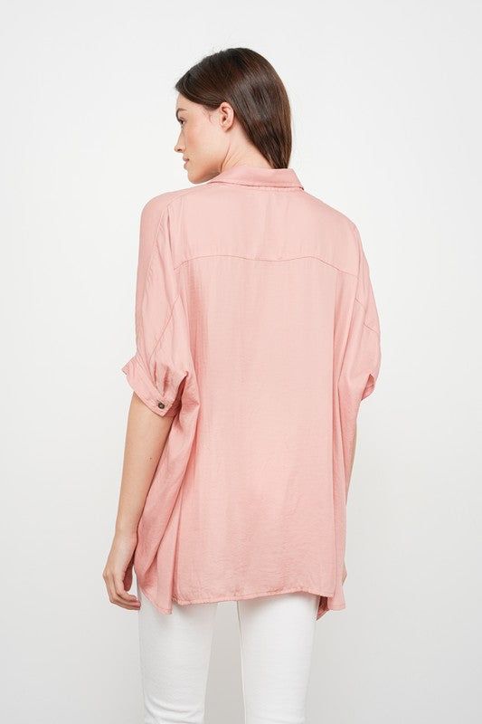 Satin button down dolman sleeve top Oversized fit 100% Polyester Rayon Button-up Top With Buttons, Oversized V-neck Blouse With Button Closure, Oversized Collared Tops For Spring, Oversized Blouse With Roll-up Sleeves And Shirttail Hem, Casual Batwing Sleeve Tops For Work, Relaxed Fit Rayon Button-up Tops, Oversized Button Blouse For Spring, Effortless Collared Top With Rolled Sleeves, Relaxed Fit Blouse With Roll-up Sleeves For Day Out