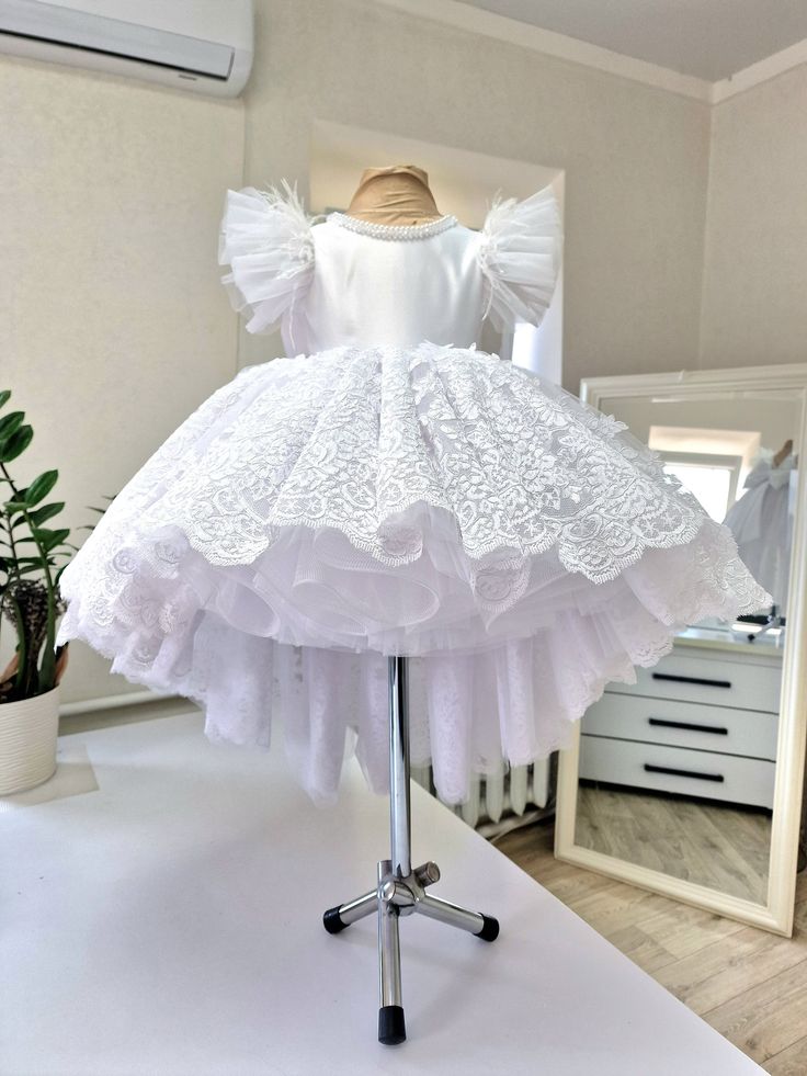 Elegant Princess Dress With Ruffles For First Communion, White Tulle Pageant Dress For Confirmation, Elegant Fitted Princess Dress For Baptism, White Ruffled Ball Gown For Pageant, White Ruffled Ball Gown For Pageants, White Pageant Dress With Ruffles Ball Gown, White Ruffled Ball Gown Pageant Dress, White Short Sleeve Confirmation Dress, White Short Sleeve Dress For Confirmation