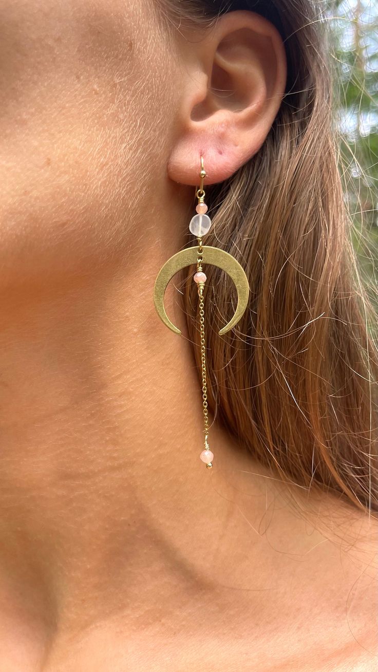 Beautiful half moon earrings with moonstone crystals. The earrings consist of brass and stainless steel parts. The earring hooks are stainless steel and therefore anti allergenic. Each item is unique and shapes and colours of the gemstones can slightly differ from the pictures. Find me on instagram: @_.amoha._ Link to instagram: https://www.instagram.com/_.amoha._?igsh=b2t1Y3FxaXk4ajJl&utm_source=qr Crescent Moonstone Earrings With Moon Charm, Adjustable Moon-shaped Moonstone Earrings, Crescent Moonstone Earrings With Moon Phase Detail, Crescent Moonstone Earrings With Moon Phase, Silversmith Earrings, Brass Jewellery, Half Moon Earrings, Earrings Moon, Moonstone Crystal