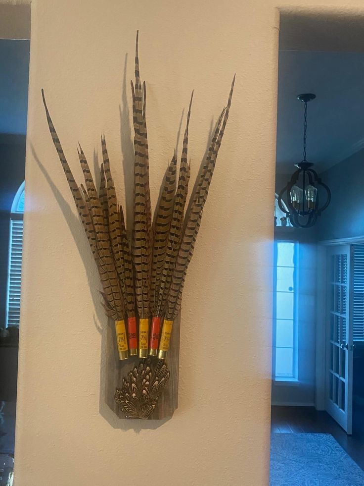 there is a wall decoration with feathers on it