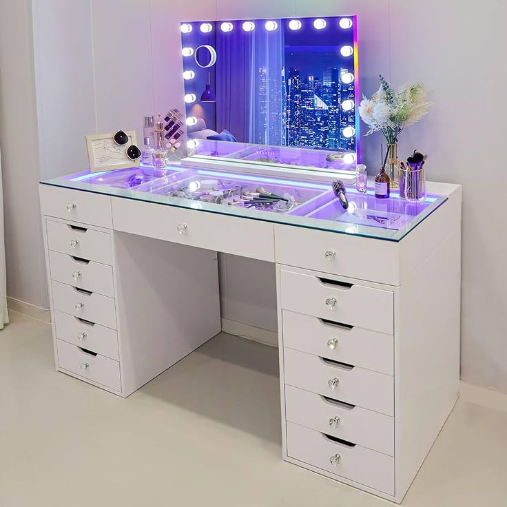 a white vanity with drawers and lights on it's sides in front of a mirror