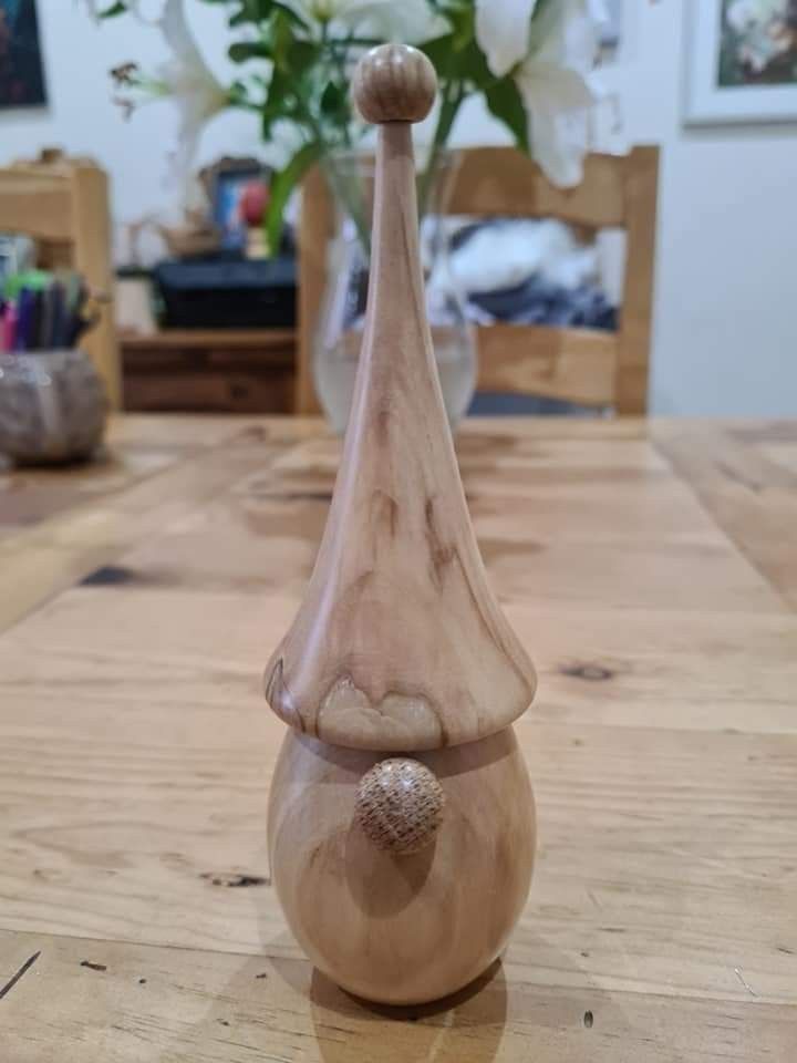 a wooden vase sitting on top of a table