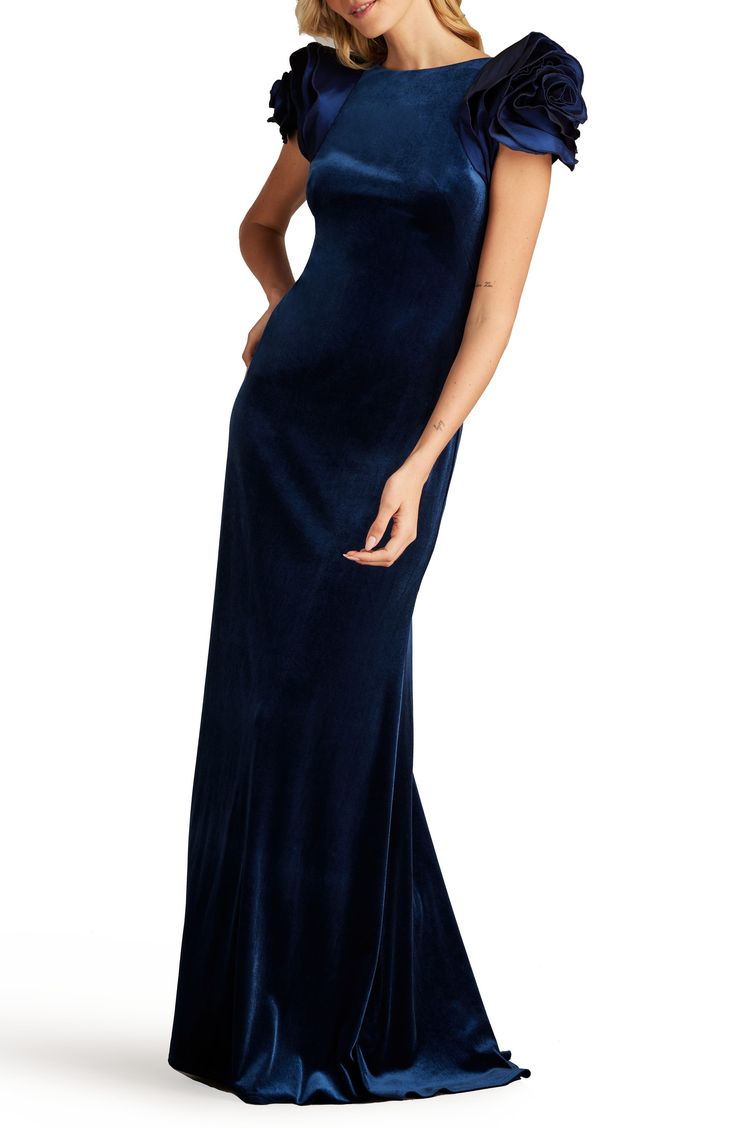 The timeless beauty of blue velvet is elegantly shown off in a striking gown designed with rosy sleeves and a puddled skirt. 60" length Hidden back-zip closure Jewel neck Short sleeves Lined 95% polyester, 5% spandex Dry clean Imported Wide Leg Jeans Cropped, Formal Wedding Guest Dress, Ruffle Gown, Sheath Gown, Velvet Gown, Formal Dresses Gowns, Tadashi Shoji, Leopard Print Blouse, Jewel Neck