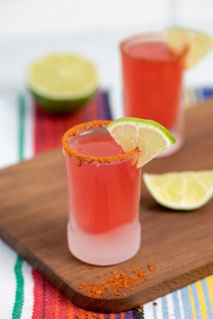 mexican candy shots on a cutting board with limes