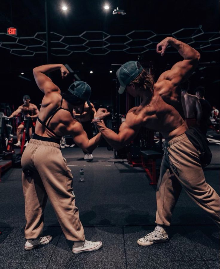 two men doing exercises in a gym