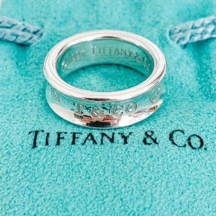 Authentic Tiffany & Co 1837 Ring In Sterling Silver. Proudly Inscribed With The Year Tiffany Was Founded, The Tiffany 1837 Collection Is Defined By Sleek Curves And Contours. This Elegant Ring Embodies A Timeless Aesthetic. Great Condition - Like New! Originally $250 Tiffany Ring Aesthetic, Luxury Engraved Ring For Anniversary, Luxury Silver Engraved Ring For Formal Occasion, Designer Rings With Polished Finish For Anniversary, Designer Hallmarked White Gold Rings, Designer White Gold Hallmarked Rings, Designer White Gold Rings Hallmarked, Luxury Sterling Silver Engraved Ring, Luxury Engraved Sterling Silver Ring With Round Band