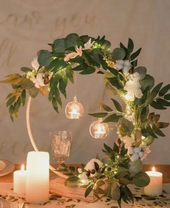 a table with candles and flowers on it