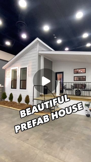 a white house with the words beautiful prefab house written in front of it