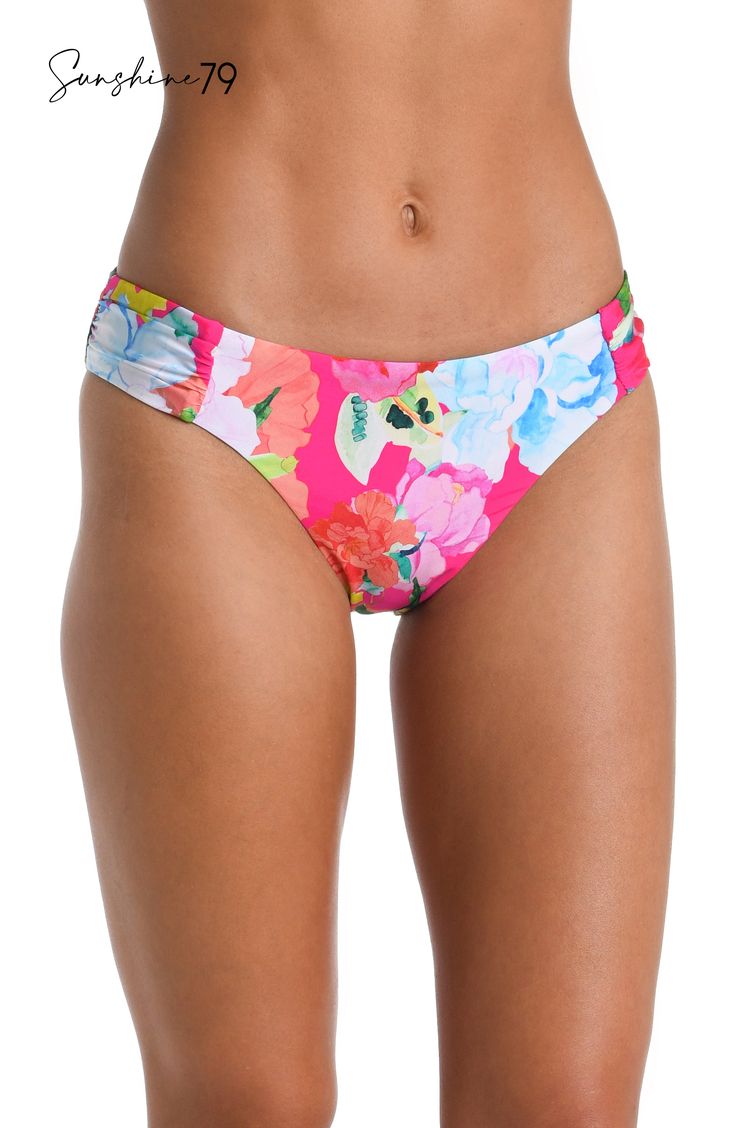 Drenched in vibrant energy, this hipster bottom by Sunshine 79 features a bold hot pink floral print that radiates an atmosphere of tropical exuberance. The vivid and lively floral pattern adds a pop of color and a sense of playful charm to your swimwear collection. At once sexy and sophisticated, these hipsters feature a high-cut front with hip-flattering shirring on each side. Just-right coverage in back keeps the look subtly seductive. [split] Details Hipster bikini bottom Hip-flattering side Tropical Pink Swimwear With Vibrant Print, Pink Tropical Swimwear With Vibrant Print, Vibrant Pink Printed Swimwear, Fitted Vibrant Print Vacation Bottoms, Fitted Bottoms With Vibrant Print For Vacation, Fitted Vibrant Print Bottoms For Vacation, Spring Pink Swimwear With Vibrant Print, Multicolor Floral Print Beachwear Bottoms, Multicolor Floral Print Bottoms For Beachwear