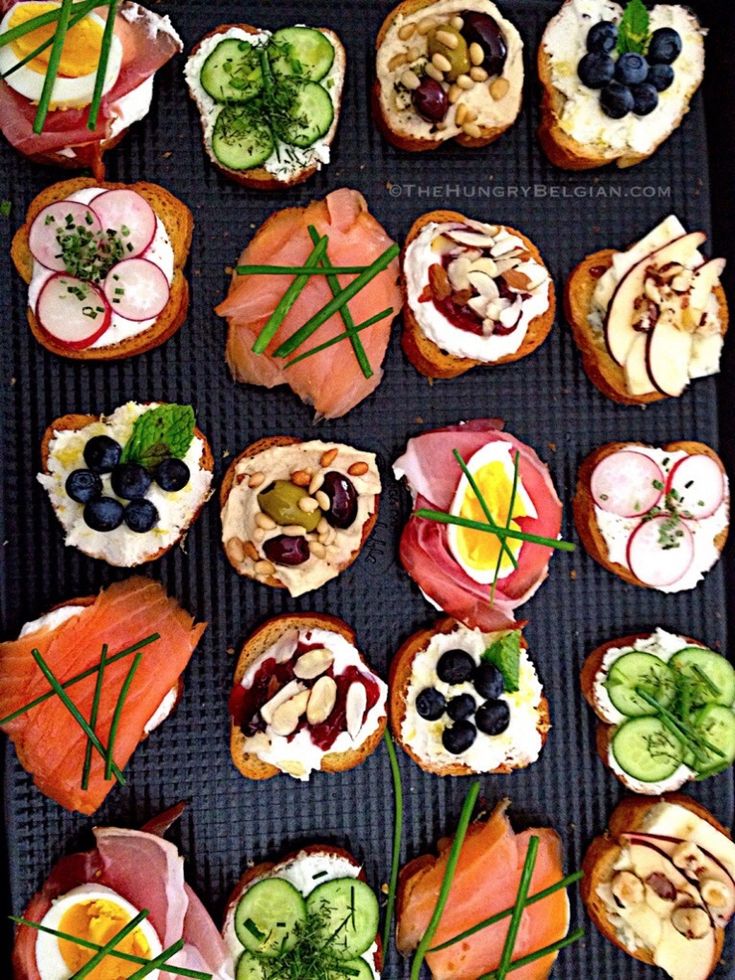 an assortment of food is displayed on a grill