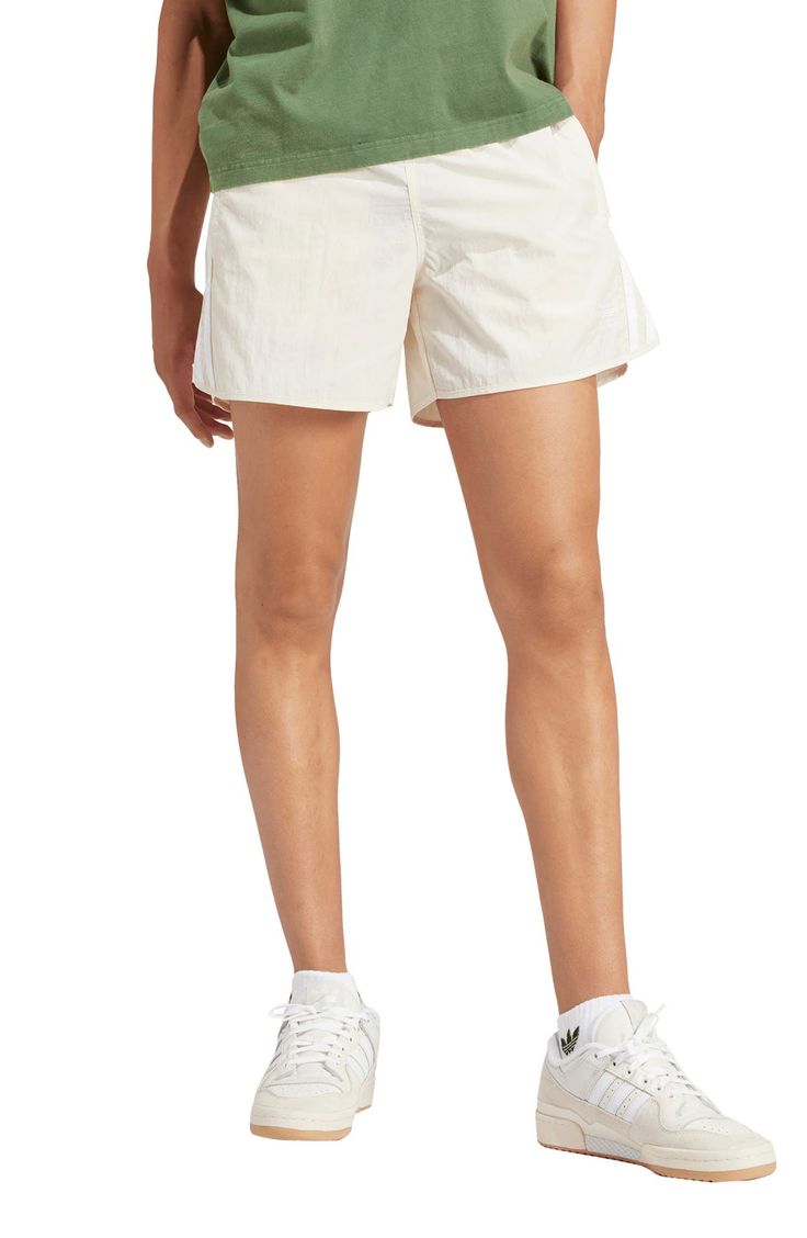 Lightweight and comfortable, these shorts made entirely of recycled fibers sport secure zippered pockets and bright 3-Stripes racing up the sides. 100% recycled polyester Machine wash, line dry Imported This product meets Nordstrom Sustainably Sourced Materials criteria: contains at least 30% sustainably sourced materials Spring Athleisure Athletic Shorts With Short Legs, High-waisted Athletic Shorts For Spring, Spring High-waisted Athletic Shorts, White Nylon Athletic Shorts For Spring, Sporty Spring Shorts With Short Inseam, Spring White Nylon Athletic Shorts, Spring Athletic Fit Moisture-wicking Shorts, Spring Athletic Shorts For Running With Relaxed Fit, Spring Running Athletic Shorts With Relaxed Fit