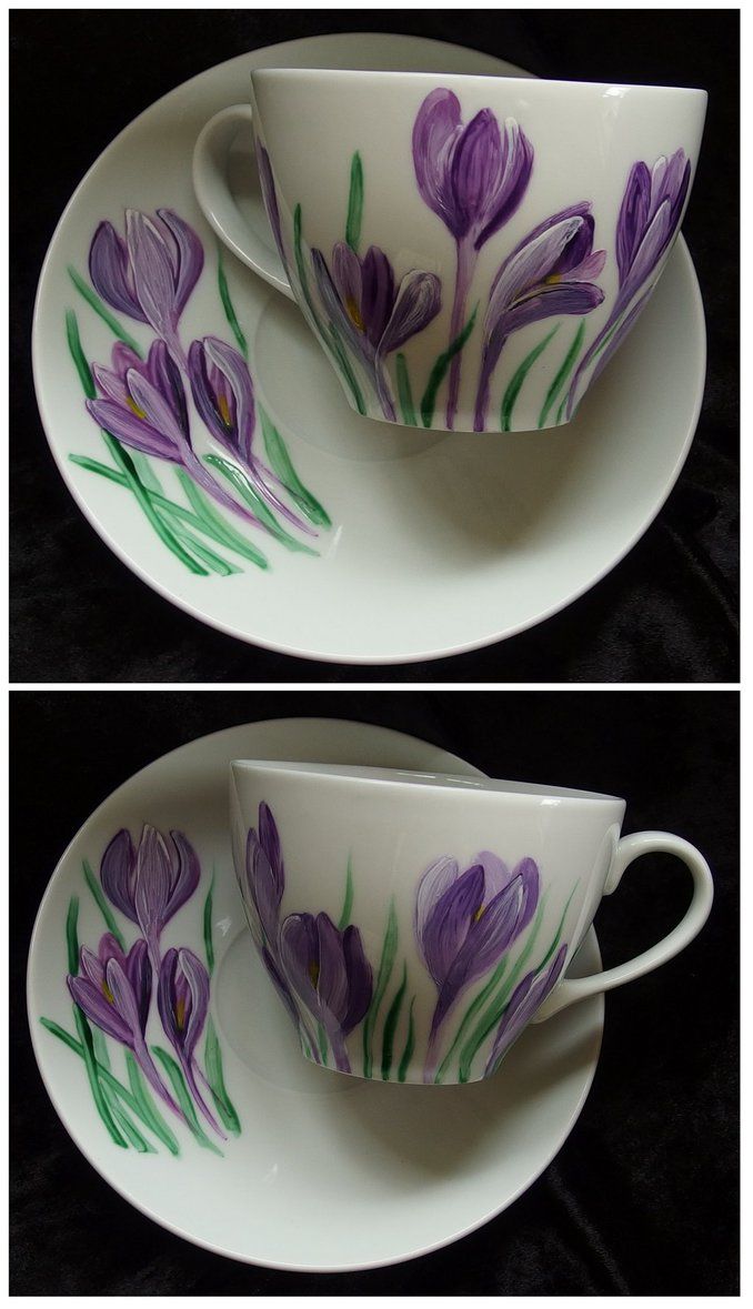 two cups and saucers with purple flowers painted on them