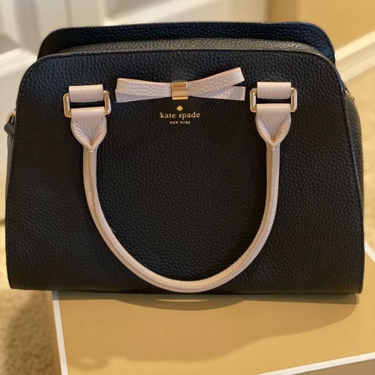 Used Look Like New Black Kate Spade Bag With Adjustable Strap, Kate Spade Black Shoulder Bag For On-the-go, Kate Spade Black Satchel Bag, Chic White Kate Spade Satchel, Kate Spade Black Satchel For Everyday Use, Kate Spade Black Bag With Gold-tone Hardware, Kate Spade Black Crossbody Satchel, Kate Spade Black Satchel, White Kate Spade Bag With Adjustable Strap