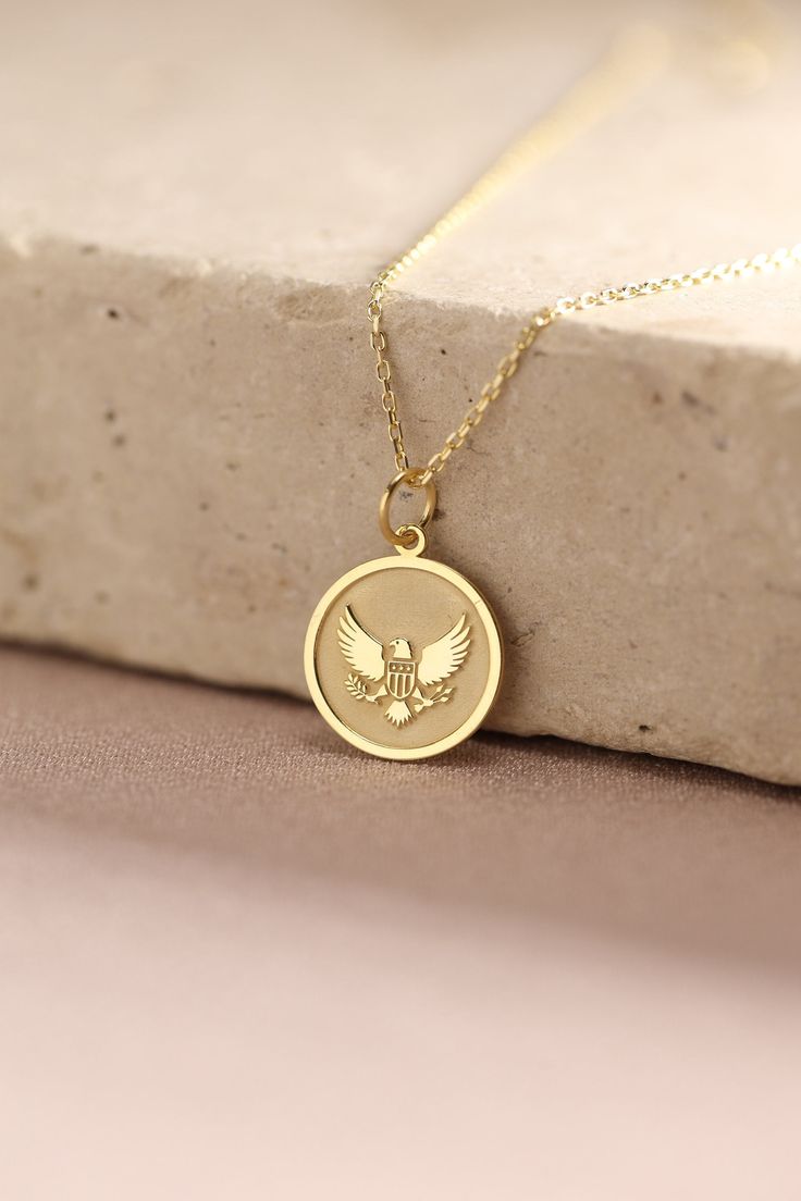 Gold Eagle Pendant - Eagle Gold Necklace ● Material of pendant: Solid Gold 14k ( REAL GOLD ) ● Metal Stamp: 14k ( REAL GOLD ) ● The pendant is available in 5 sizes: - 12,7 mm / 0.5 inches (Diameter) - 14,0 mm / 0,55 inches ( Diameter ) In the photos - 15,3 mm / 0.6 inches ( Diameter ) - 16,5 mm / 0,65 inches ( Diameter ) - 19,1 mm / 0,75 inches ( Diameter ) ( In the photos the size is 14mm / 0.55 inches Diameter ) ( Jump Ring inner diameter: 4 mm ) ● Material of chain: Solid gold 14k ( REAL GOLD Symbolic Charms Necklaces For Commemoration, Symbolic Charms Necklace For Commemoration, Tarnish Resistant Pendant Charm Necklace For Anniversary, Commemoration Pendant Necklaces With Charms, Commemorative Pendant Necklaces With Charms, Commemoration Charms Necklace With Round Pendant, Commemorative Pendant Necklace With Charms, Gold Charm Necklaces For Commemoration, Yellow Gold Jewelry With Charms For Birthday Gift