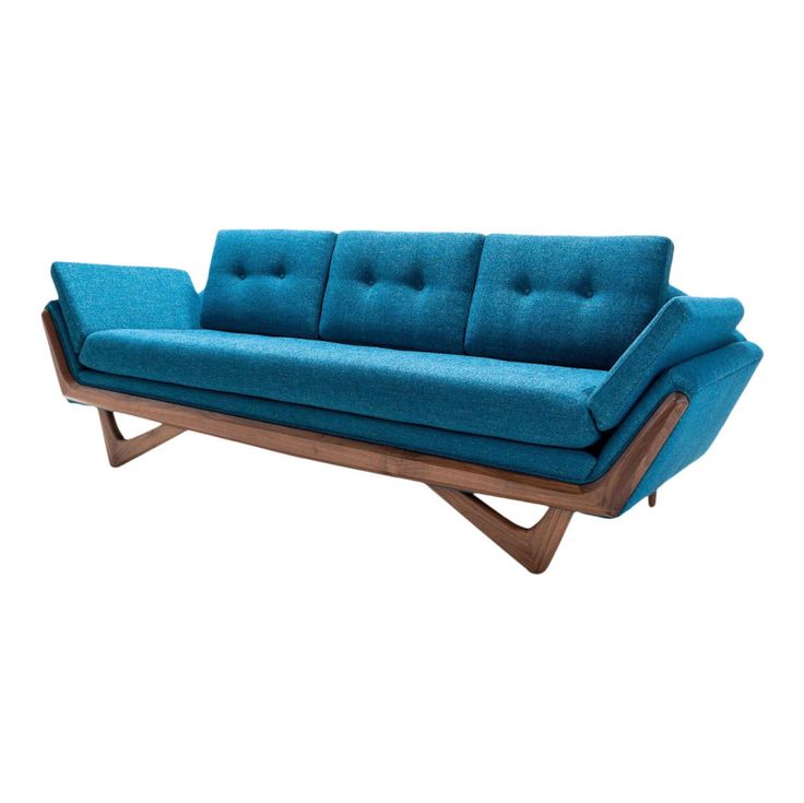 a blue couch sitting on top of a wooden frame