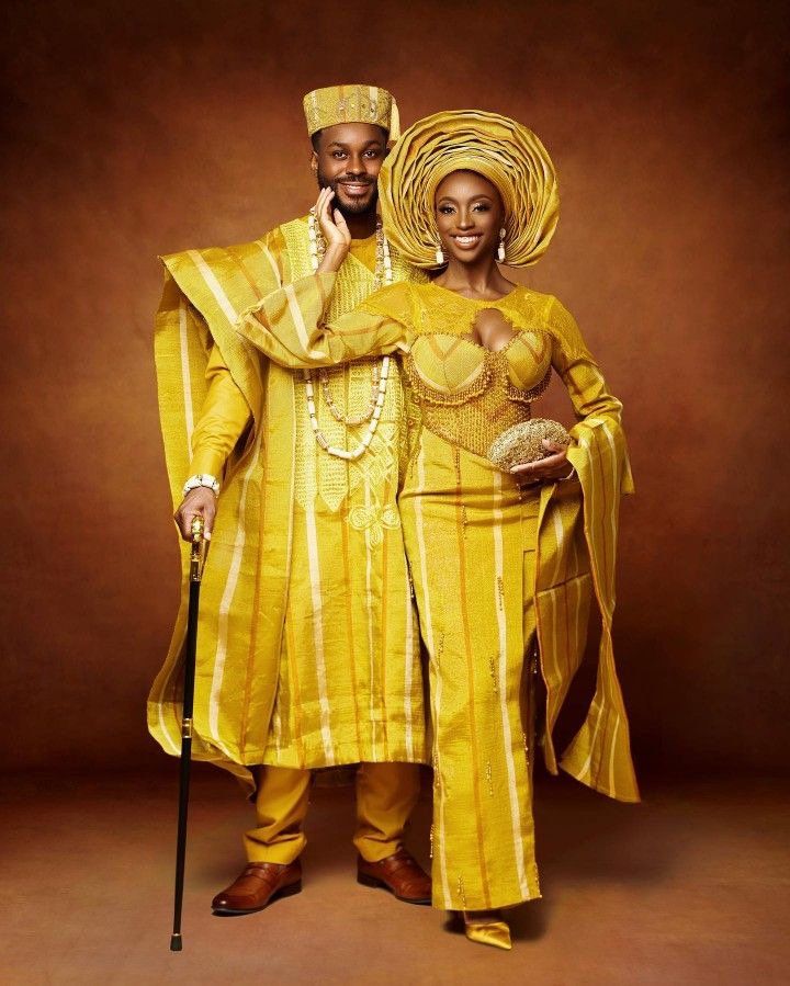 A perfect outfit for couples on their wedding or anniversary and it's also a perfect outfit for photoshoots and Birthdays. Proudly African Send in your measurements as follows when ordering: BRIDE a. Burst b. Waist c. Shoulder d. Sleeve length e. Round sleeve f. Hips g. Skirt length h. Half Length  i.  Top Length (if applicable) GROOM a. Long sleeve hand length b. Trouser length c. Chest d. Desired agbada length e. Waist f. Shoulder g. Top length This is a beautiful piece that will have you look Ankara And Cord Lace Combination, Wedding Guest African, Ankara Flared Dress, Outfit For Couples, Photoshoot Birthday, African Kaftan, Ankara Maxi Dress, African Weddings, African Party Dresses