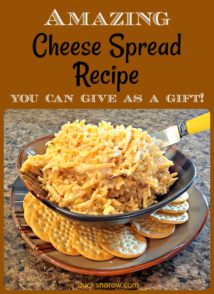 a plate with crackers and cheese on it that says amazing cheese spread recipe you can give as a gift