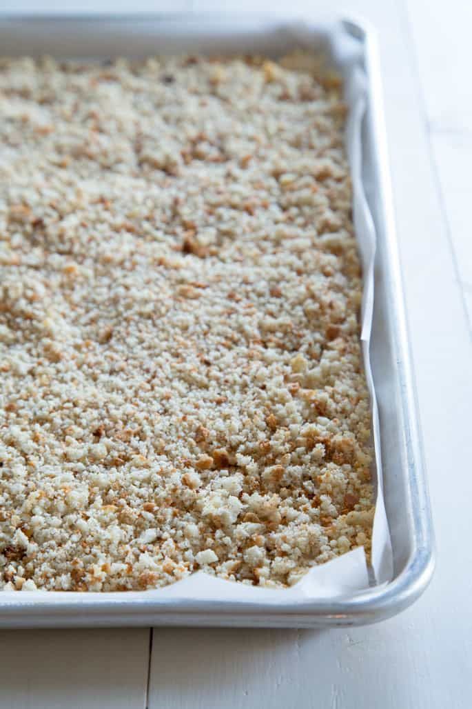 a casserole dish with some crumbs on it