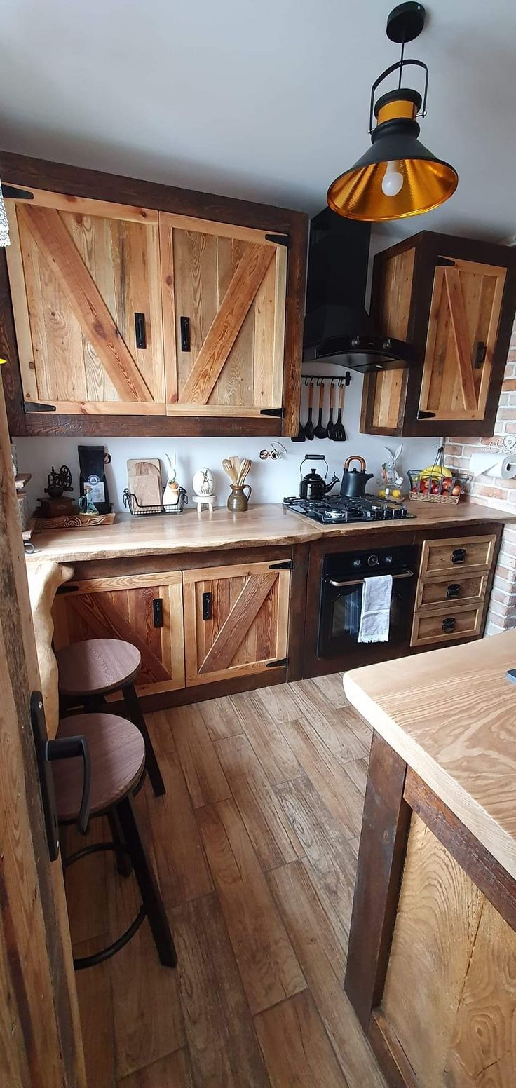 a kitchen with wooden cabinets and an island