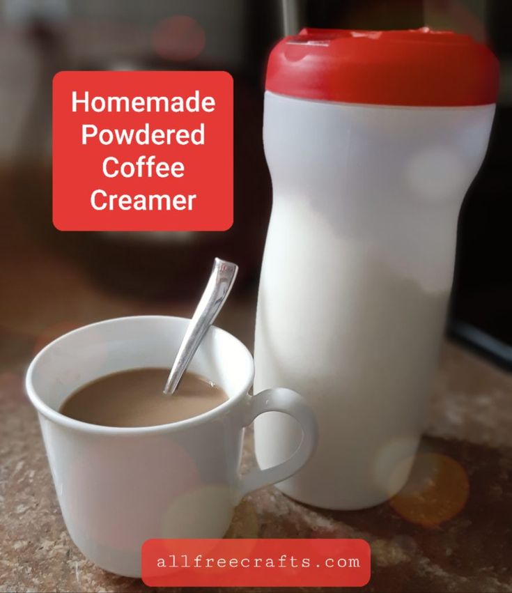 a cup of coffee next to a shaker with a spoon in it and the words homemade powdered coffee creamer