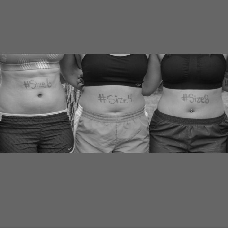 three women with tattoos on their stomachs are standing in front of each other and holding hands behind their backs