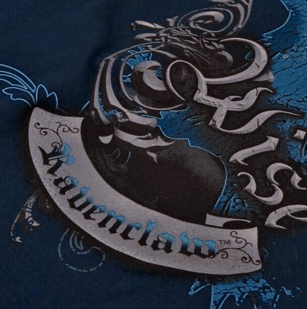 a blue t - shirt with an ornate design on it