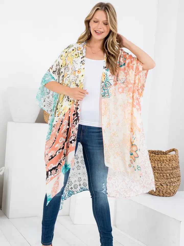 . Crafted with 100% viscose, this kimono presents a casual aesthetic that's perfect for resort or vacation occasions. The design, inspired by nature, wildlife, vintage, and whimsical prints, truly captures the essence of the brand. Its 'Missy' fit ensures a flattering silhouette for contemporary women, making it a delightful addition to your wardrobe. White Boho Print Kimono For Beach Cover-up, Vacation Beach Cover-up Kimono With Kimono Sleeves, Bohemian Rayon Cover-up For Vacation, Casual Multicolor V-neck Kimono, Bohemian Short Sleeve Kimono One Size, Multicolor Summer Kimono For Beach Cover-up, Casual V-neck Kimono With Boho Print, Casual Patterned Kimono For Beach Cover-up, Multicolor Boho Print Free Size Kimono