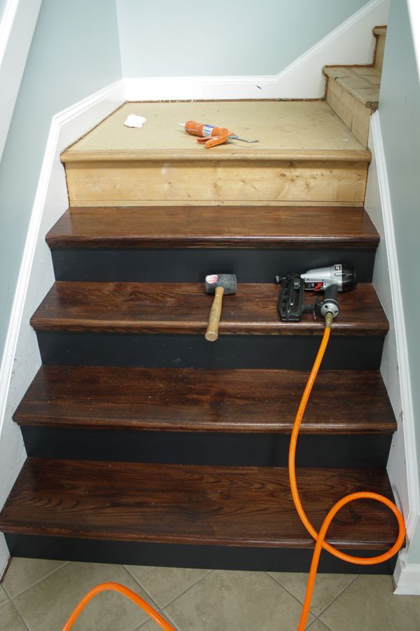 a set of stairs with an orange cord attached to it