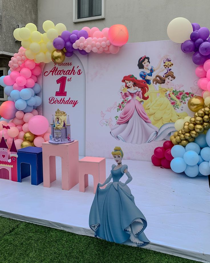 a princess themed birthday party with balloons and decorations