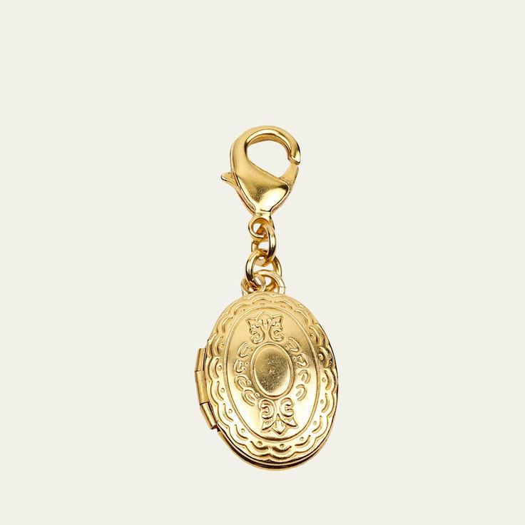 Engraved chain locket charm by Ben-Amun. 24-karat gold electroplating. Approx. 1.50"L x 0.75"W. Lobster claps. Made in USA. Gold-plated Pendant Locket Necklace, Gold-tone Gold Plated Pendant Locket Necklace, Gold Medallion Locket Necklace With Lobster Clasp, Gold-plated Gold Locket Necklace Pendant, Gold-tone Pendant Locket Necklace, Gold Metal Pendant Locket Necklace, Gold Plated Pendant Locket Necklace, Gold Plated Gold Locket Pendant Necklace, Gold Round Pendant Locket Necklace With Charms