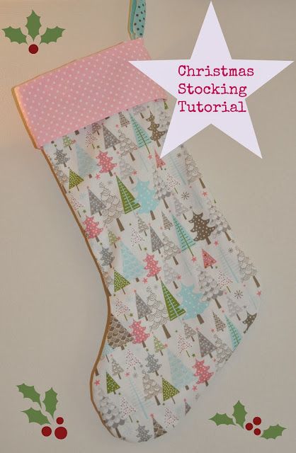 a christmas stocking hanging on the wall with polka dot trimmings and trees