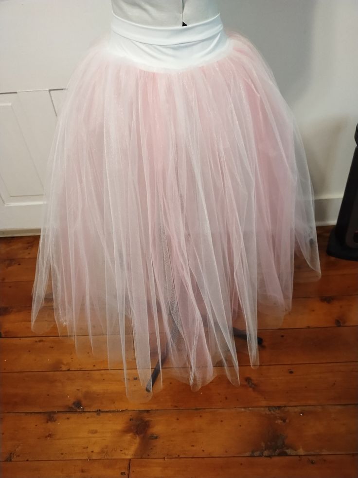 A s/m practice or recital stretch romantic tutu with a hidden pink layer. Length of skirt is 28 inches. Ballet Style Tulle Petticoat For Spring, Spring Ballet Tulle Petticoat, Feminine Fitted Tulle Skirt, Pink Stretch Tutu Dress For Spring, Pink Stretch Tulle Tutu Dress, Spring Balletcore Tutu Dress For Dance, Spring Balletcore Tutu Dance Dress, Fitted Pink Balletcore Skirt, Stretch Pink Tulle Petticoat